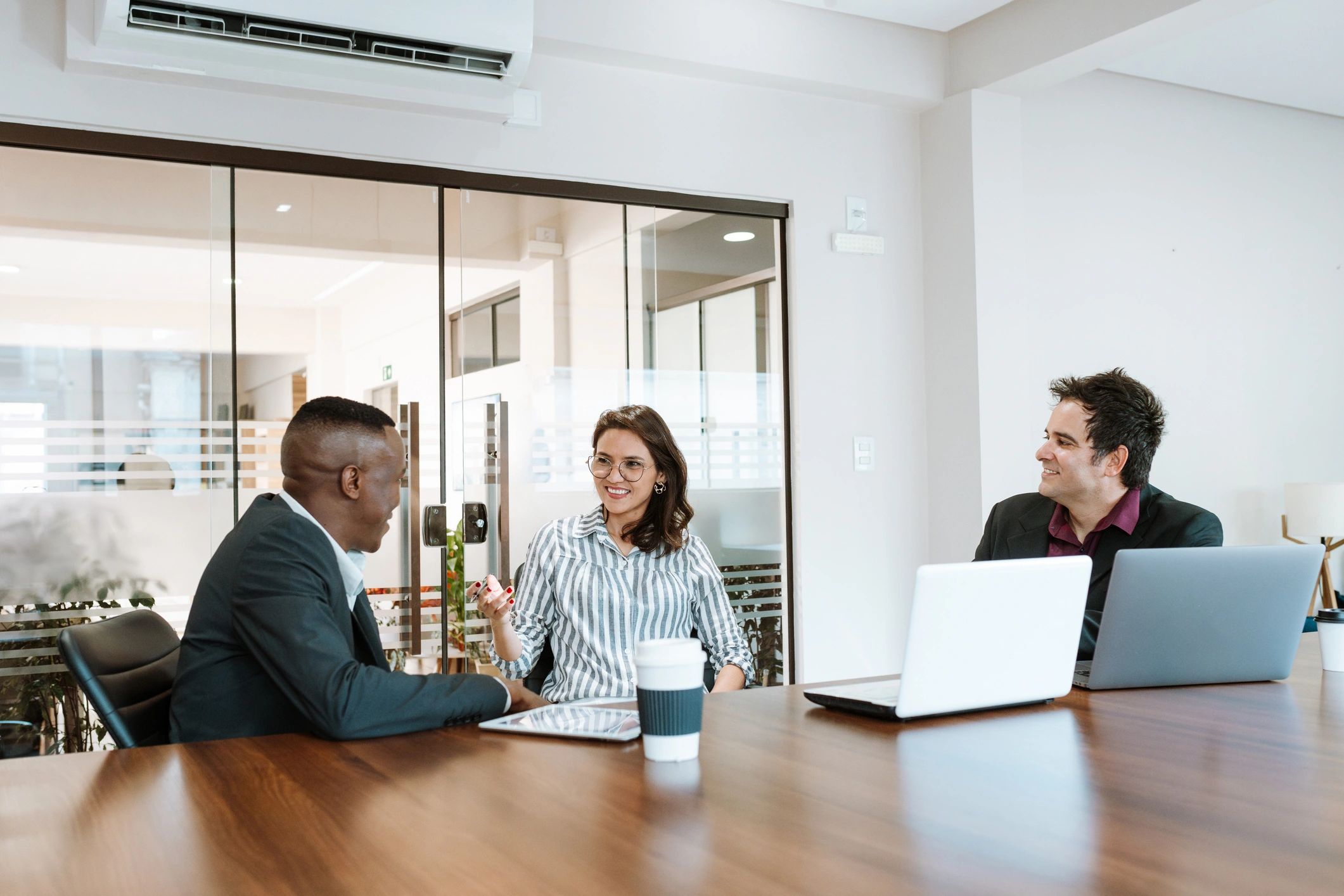 Leadership team in discussion in a professional meeting room