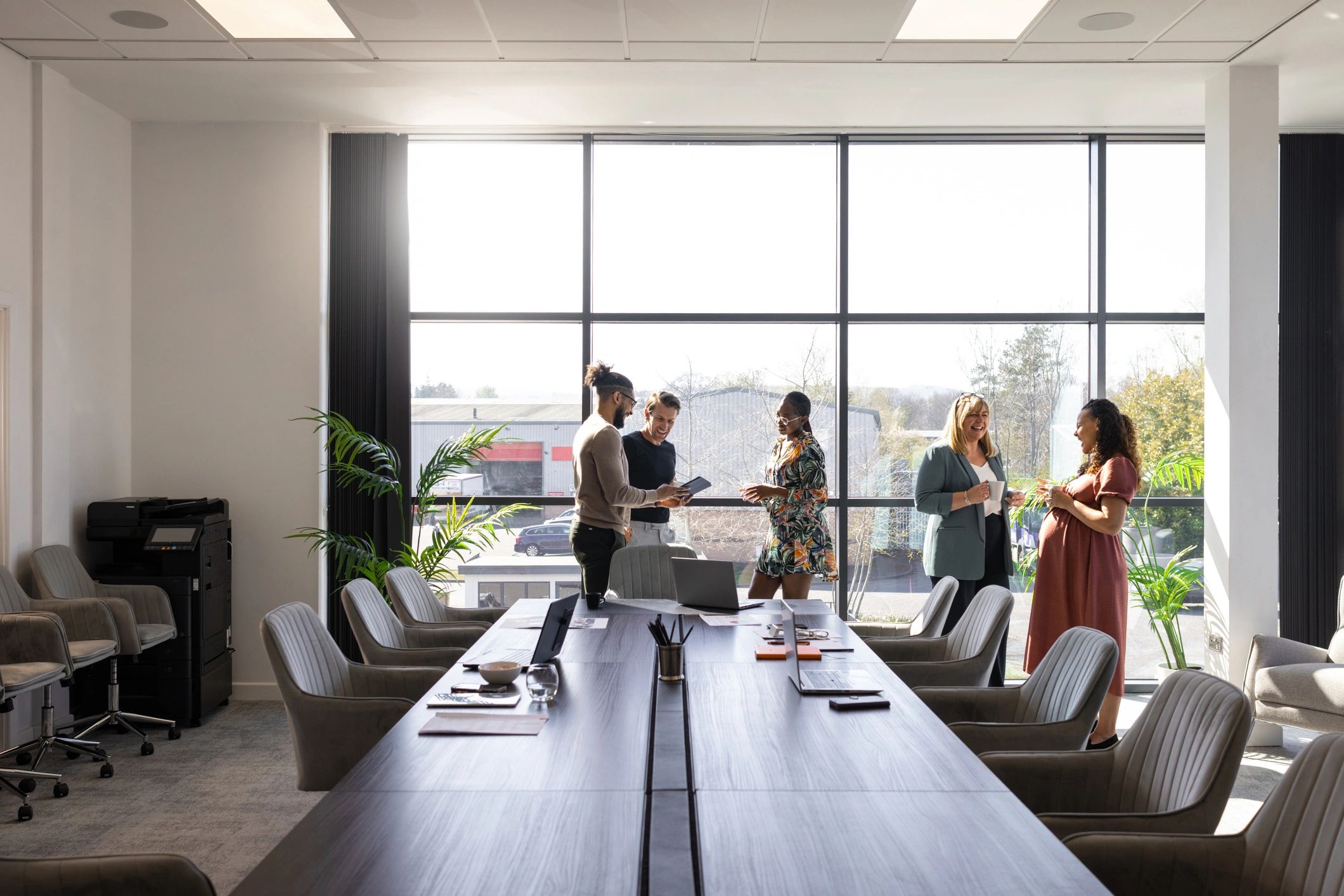 Executives in a modern conference room discussing strategy